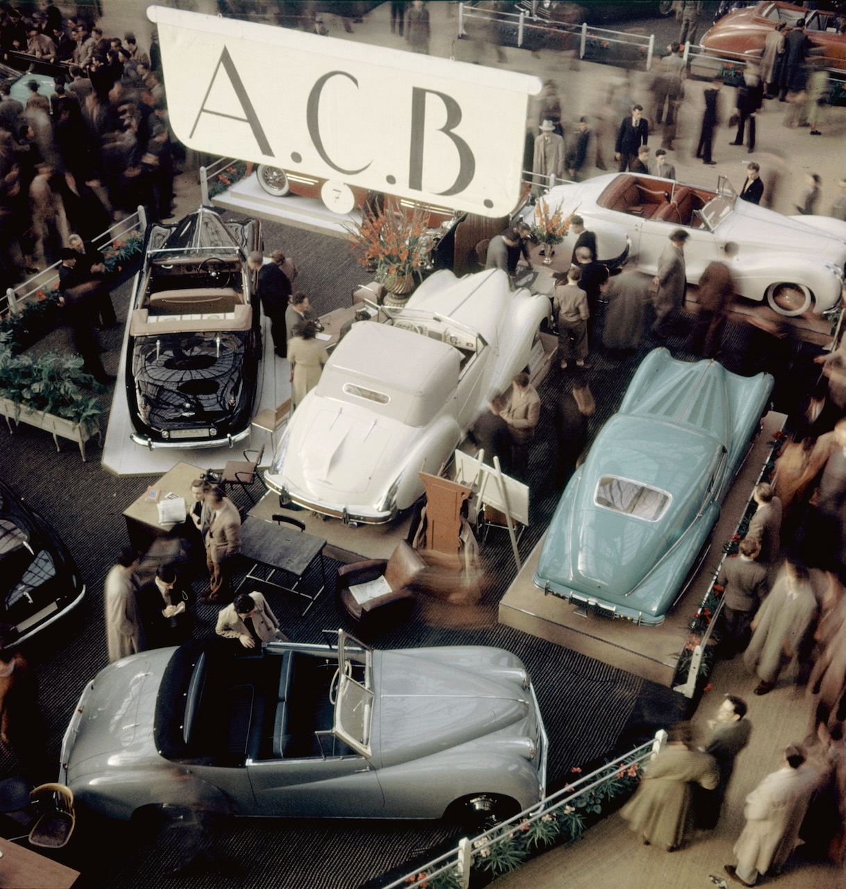 Subject: Luxury section of the Paris Auto Show Salon with A.C.B. Bodies (Atelier de Carrosserie de Becon). In the foreground is a 11 HP Citroen chassis with A.C.B. body. Three cars behind are peacock blue nad grey Talbot, and a yellow Delahaye. Paris France 1948
Photographer- Yale Joel
Time Inc Owned
Merlin-1153900